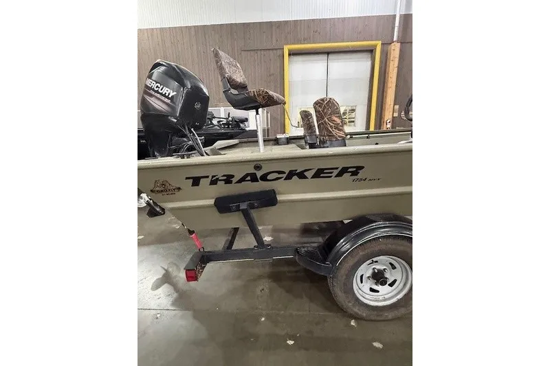 Slide: The Image of 2017 Tracker Grizzly 1754 MVX SC boat with Mercury engine on trailer. - 5