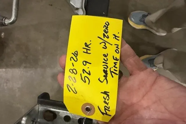Slide: The Image of Yellow service tag with handwritten notes for a 2017 Tracker Grizzly 1754 MVX SC. - 8