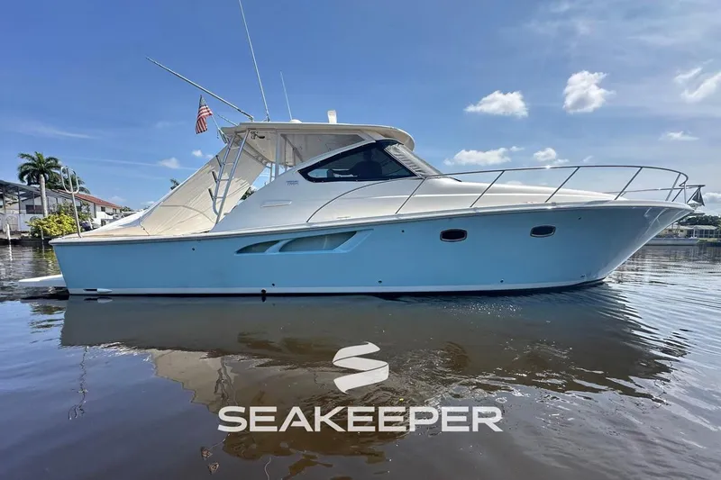 The Image of 2018 Tiara Yachts 4300 Open boat on calm water, featuring sleek design and Seakeeper logo. - 0