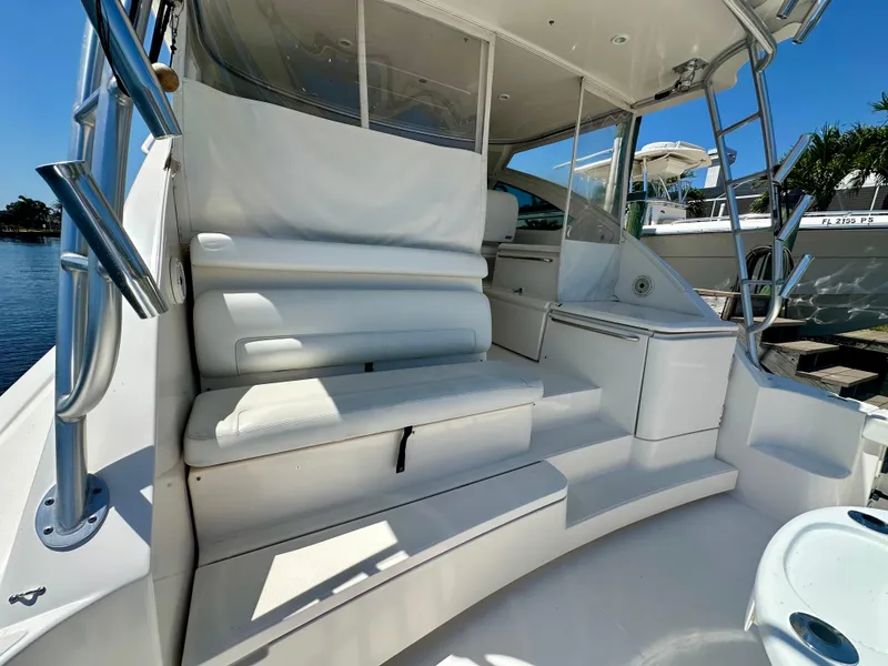 Slide: The Image of 2018 Tiara Yachts 4300 Open interior with white seating and sleek design. - 11