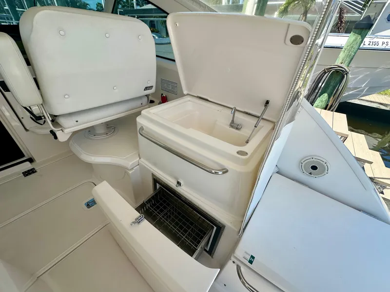 Slide: The Image of 2018 Tiara Yachts 4300 Open interior with sink and storage compartments. - 14