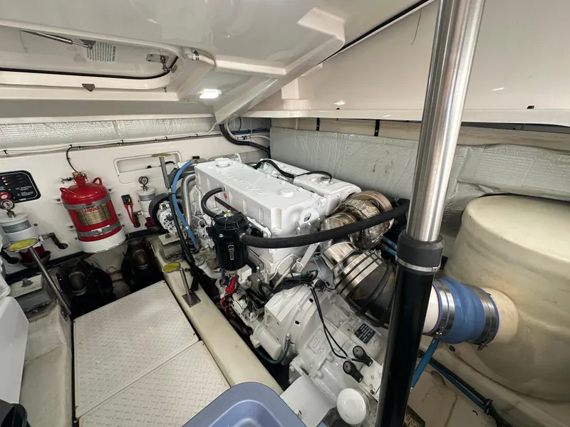 Slide: The Image of Engine room of 2018 Tiara Yachts 4300 Open, showcasing machinery and fire safety equipment. - 36