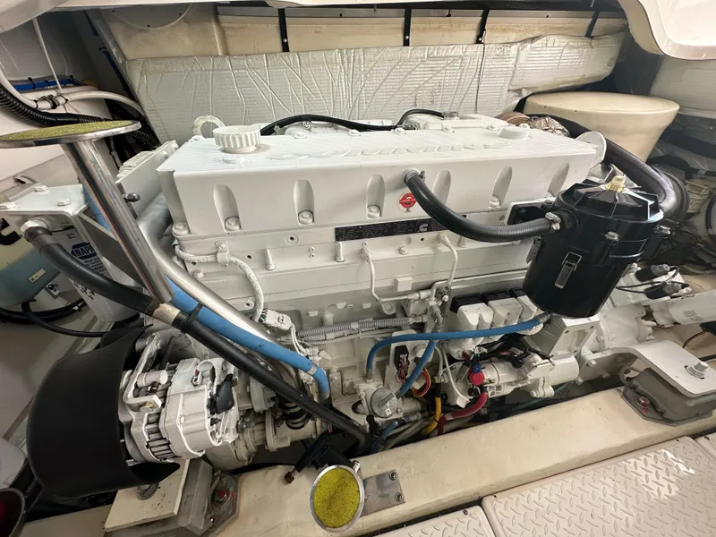 Slide: The Image of Engine room of a 2018 Tiara Yachts 4300 Open, showcasing a clean, well-maintained engine. - 40