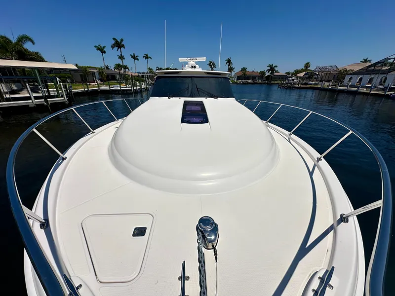 Slide: The Image of 2018 Tiara Yachts 4300 Open on calm water, showcasing sleek deck design. - 9