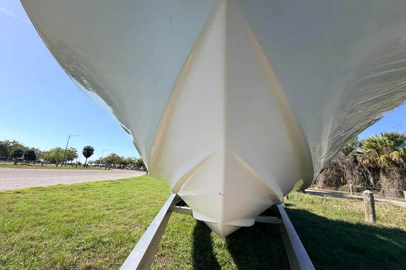 Slide: The Image of Underneath view of a 2010 Canyon Bay 24H boat on a trailer, sunny day. - 10