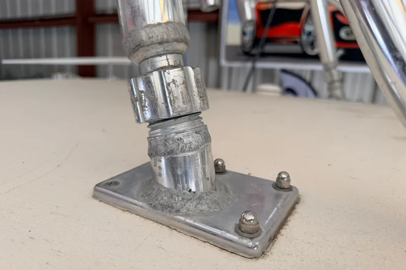 Slide: The Image of Close-up of a metal fitting on a 2010 Canyon Bay 24H boat. - 102