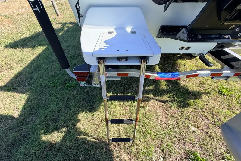 Slide: The Image of Rear view of 2010 Canyon Bay 24H boat with ladder on grass. - 11