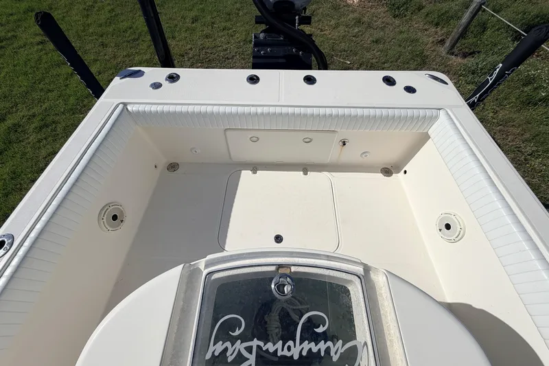 Slide: The Image of 2010 Canyon Bay 24H boat interior with spacious deck and storage compartments. - 14