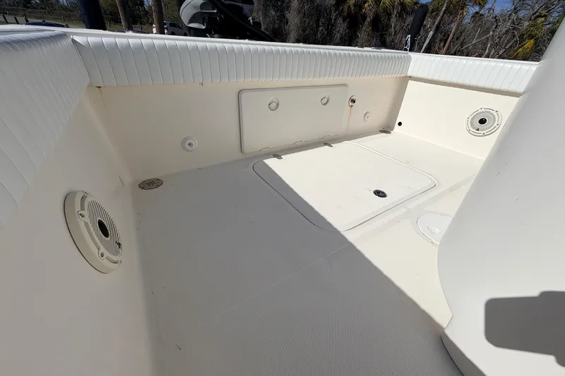Slide: The Image of 2010 Canyon Bay 24H boat interior with storage compartments and speakers. - 15
