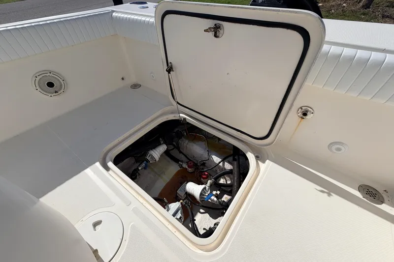 Slide: The Image of Open hatch on 2010 Canyon Bay 24H boat showing internal components. - 20