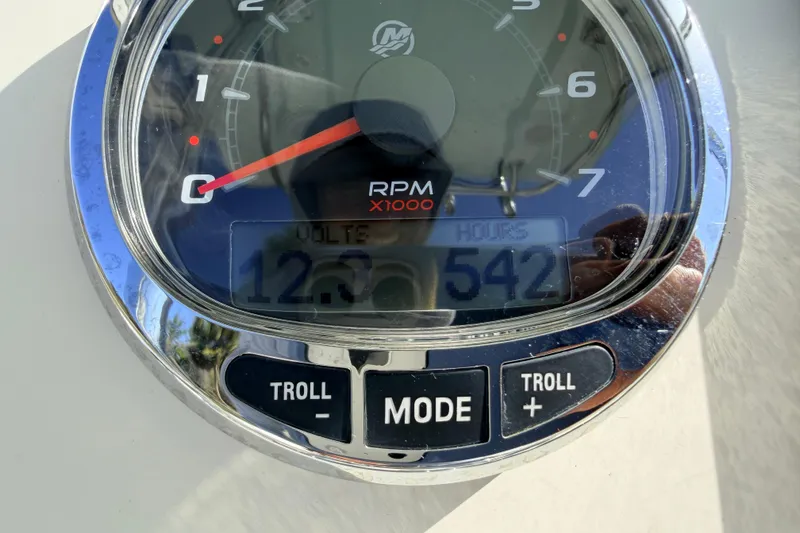Slide: The Image of Close-up of a Canyon Bay 24H 2010 boat tachometer displaying RPM and engine hours. - 32