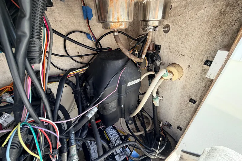 Slide: The Image of Electrical wiring and components inside a 2010 Canyon Bay 24H boat. - 44
