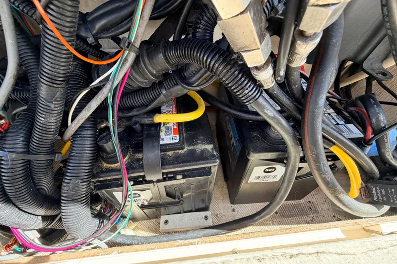 Slide: The Image of Electrical wiring and batteries inside a 2010 Canyon Bay 24H boat. - 45