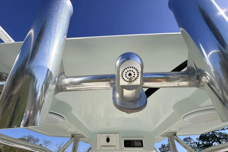 Slide: The Image of 2010 Canyon Bay 24H boat T-top with stainless steel rod holders and electronics. - 47