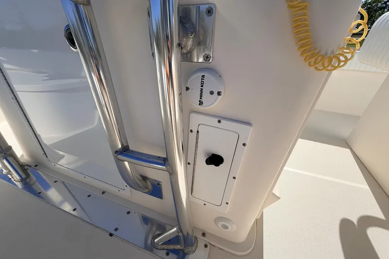 Slide: The Image of 2010 Canyon Bay 24H boat interior with stainless steel railing and control panel. - 57