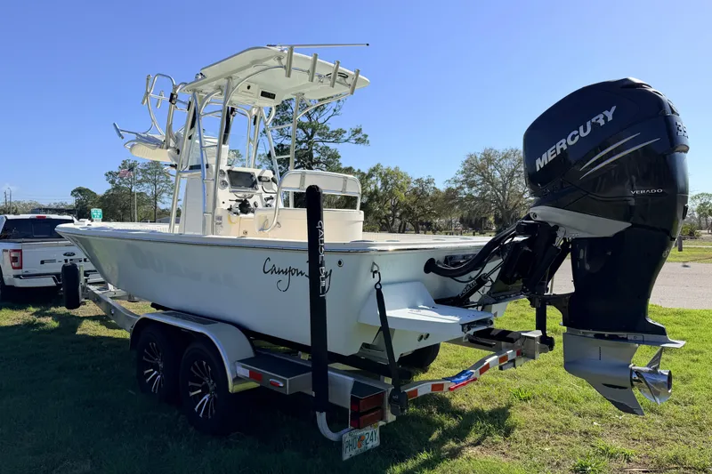 Slide: The Image of 2010 Canyon Bay 24H boat on trailer with Mercury Verado engine. - 6