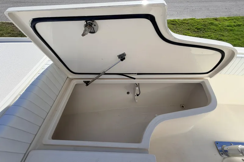 Slide: The Image of Open storage compartment on a 2010 Canyon Bay 24H boat, showcasing interior space. - 63