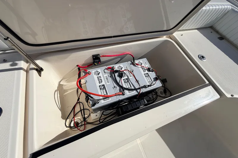 Slide: The Image of Battery compartment of 2010 Canyon Bay 24H boat with wiring and connections. - 66