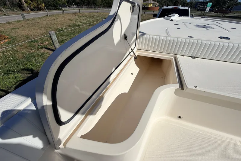 Slide: The Image of Open storage compartment on a 2010 Canyon Bay 24H boat, showcasing spacious interior. - 69