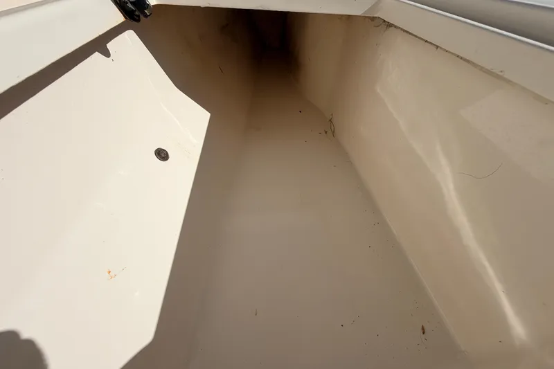 Slide: The Image of Interior storage compartment of a 2010 Canyon Bay 24H boat, showing clean, spacious design. - 70
