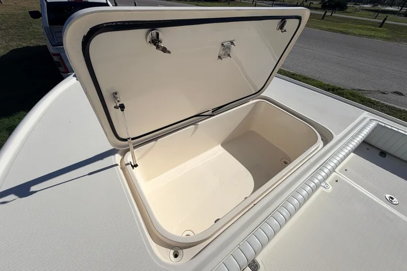 Slide: The Image of Open storage compartment on a 2010 Canyon Bay 24H boat deck. - 71