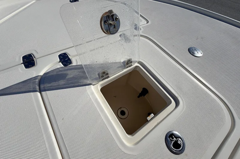 Slide: The Image of Open storage compartment on 2010 Canyon Bay 24H boat deck. - 73