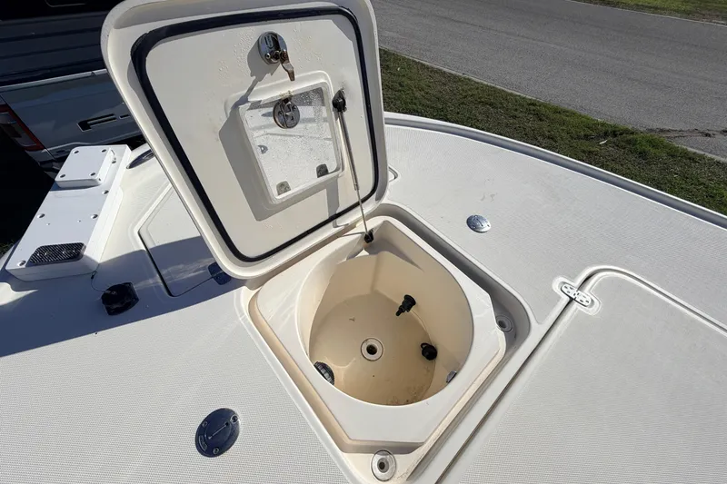 Slide: The Image of Open storage compartment on 2010 Canyon Bay 24H boat deck. - 74