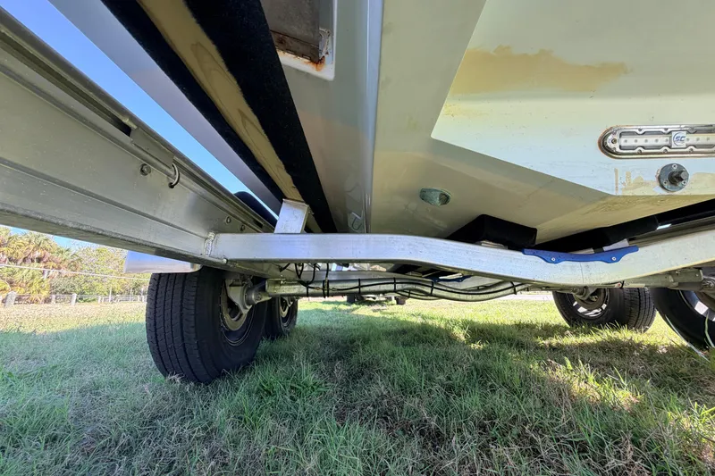 Slide: The Image of Underneath view of a 2010 Canyon Bay 24H boat on a trailer. - 87