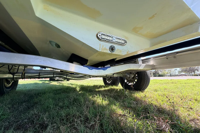 Slide: The Image of Underneath view of a 2010 Canyon Bay 24H boat on a trailer. - 88