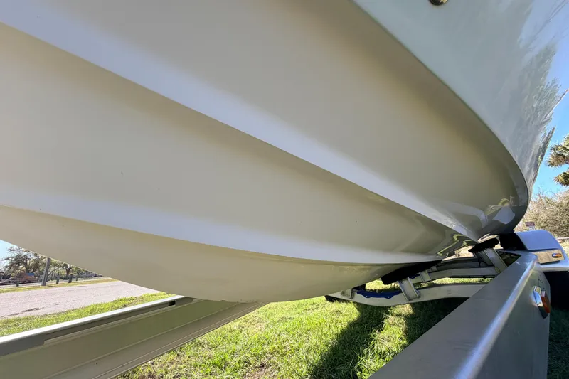 Slide: The Image of 2010 Canyon Bay 24H boat hull on trailer, side view. - 91