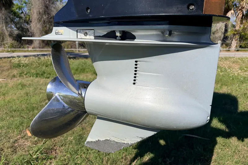 Slide: The Image of Propeller of a 2010 Canyon Bay 24H boat on grassy background. - 95