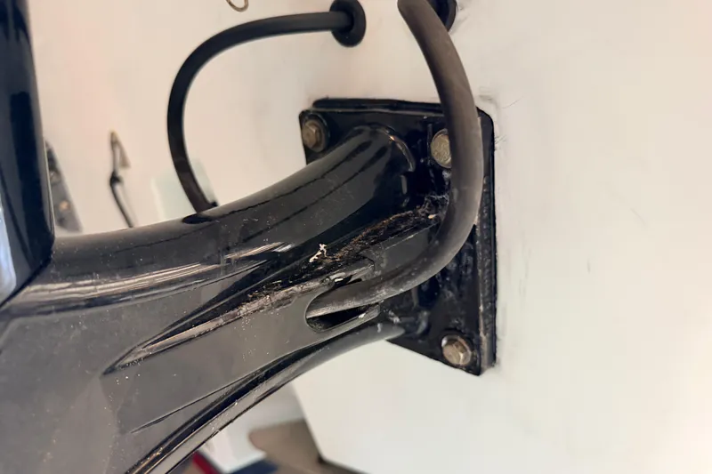 Slide: The Image of Close-up of a 2010 Canyon Bay 24H boat motor mount with visible wear. - 98