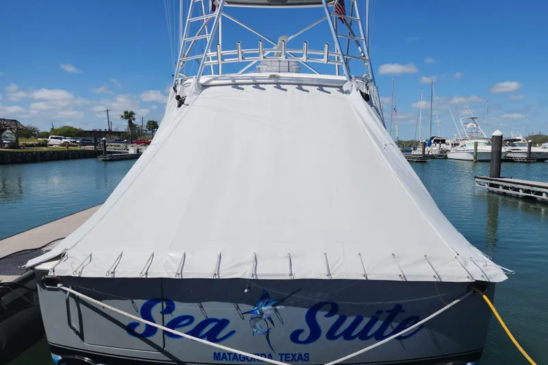 Slide: The Image of 2018 Viking 48 Sport Tower docked, covered, with "Sea Suite" name, Matagorda, Texas. - 10