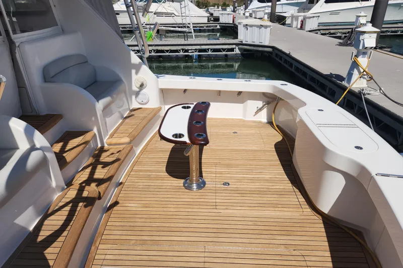 Slide: The Image of Spacious deck of 2018 Viking 48 Sport Tower yacht at marina. - 104