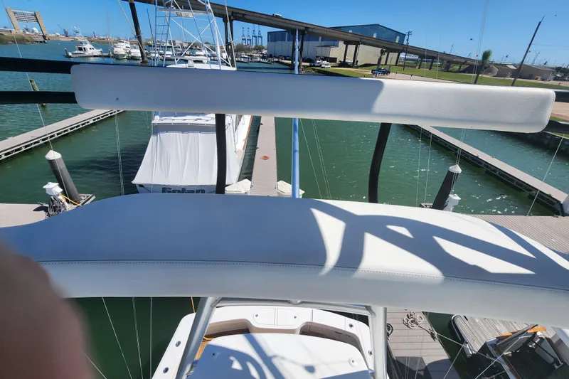 Slide: The Image of 2018 Viking 48 Sport Tower yacht docked at marina, view from upper deck. - 112