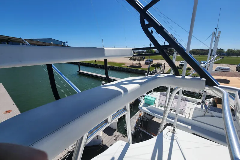 Slide: The Image of 2018 Viking 48 Sport Tower yacht docked at marina, view from upper deck. - 116
