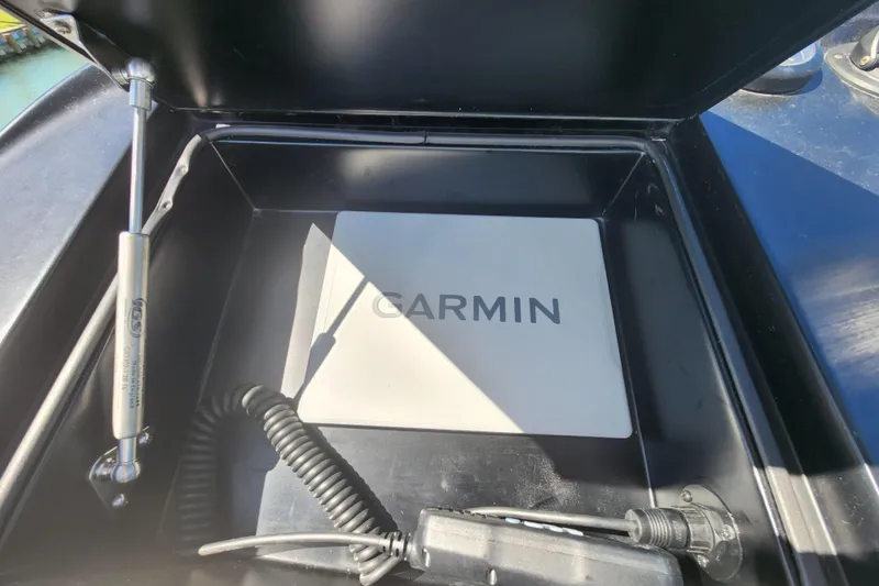 Slide: The Image of Garmin device in a 2018 Viking 48 Sport Tower boat compartment. - 117