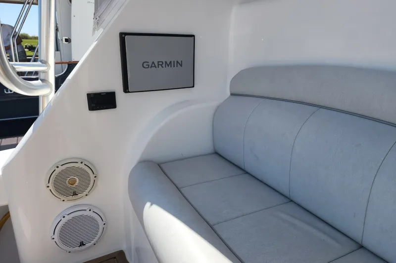 Slide: The Image of Interior of 2018 Viking 48 Sport Tower with Garmin display and cushioned seating. - 123