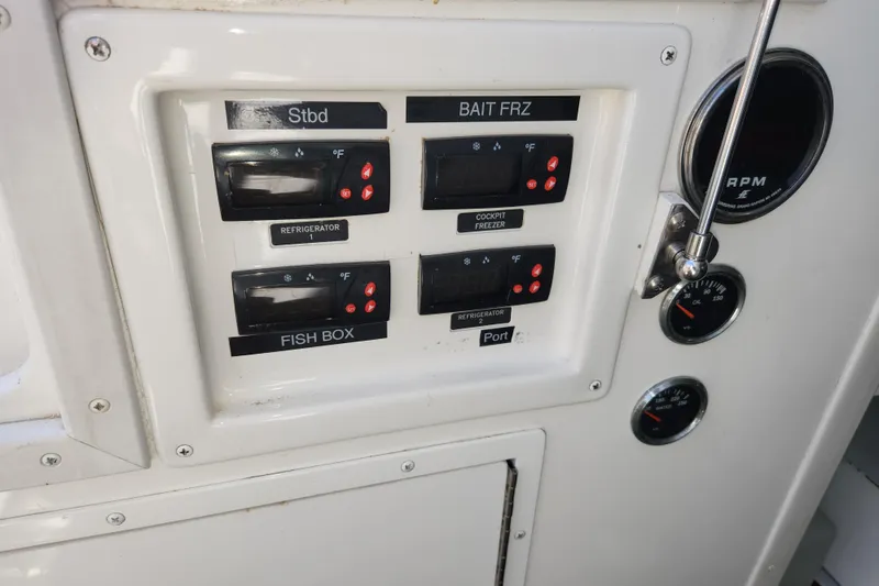 Slide: The Image of Control panel of a 2018 Viking 48 Sport Tower with temperature settings and gauges. - 127