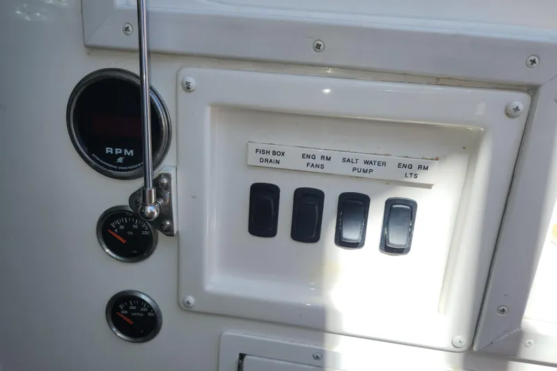 Slide: The Image of Control panel of a 2018 Viking 48 Sport Tower boat with switches and gauges. - 133
