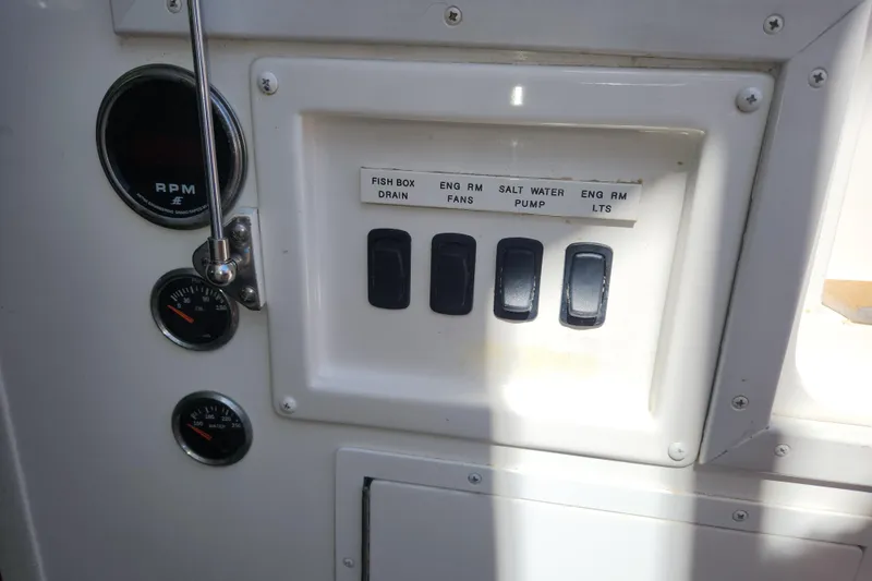 Slide: The Image of Control panel of 2018 Viking 48 Sport Tower with switches and gauges. - 134
