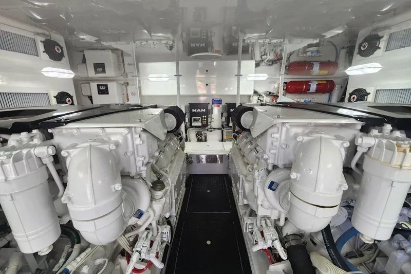 Slide: The Image of Engine room of a 2018 Viking 48 Sport Tower yacht, featuring dual MAN engines. - 136