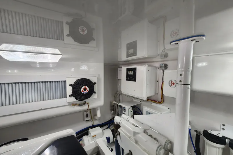Slide: The Image of Engine room of 2018 Viking 48 Sport Tower with ventilation and control systems. - 149