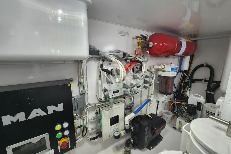 Slide: The Image of Engine room of 2018 Viking 48 Sport Tower with MAN components and fire suppression system. - 151