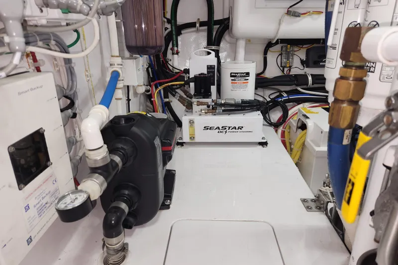 Slide: The Image of Engine room of 2018 Viking 48 Sport Tower with SeaStar DC power steering system. - 154