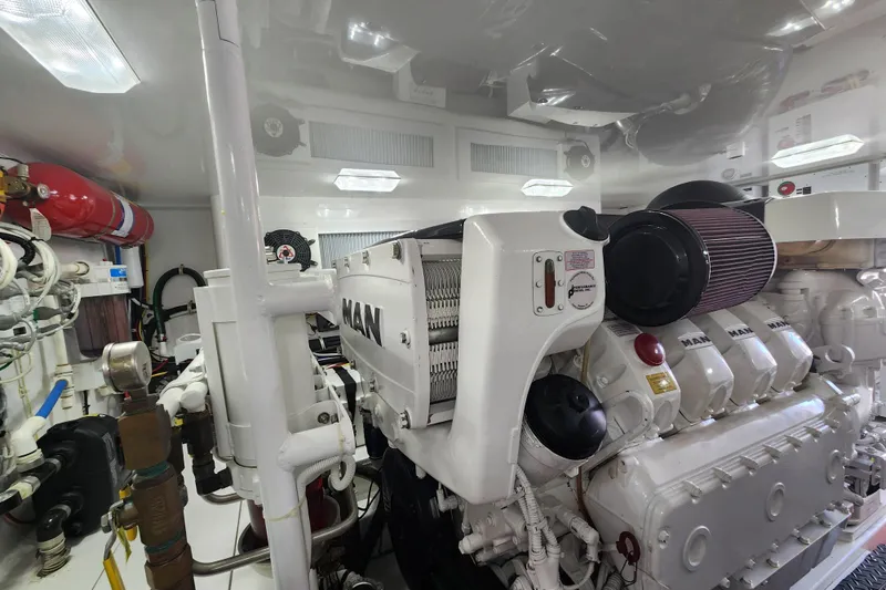 Slide: The Image of Engine room of a 2018 Viking 48 Sport Tower with MAN engine components. - 157