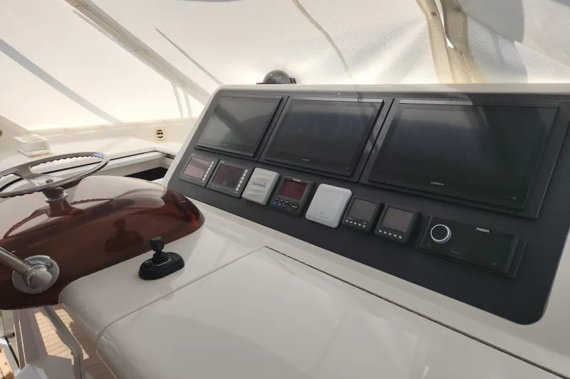 Slide: The Image of Helm of 2018 Viking 48 Sport Tower with advanced navigation displays. - 16