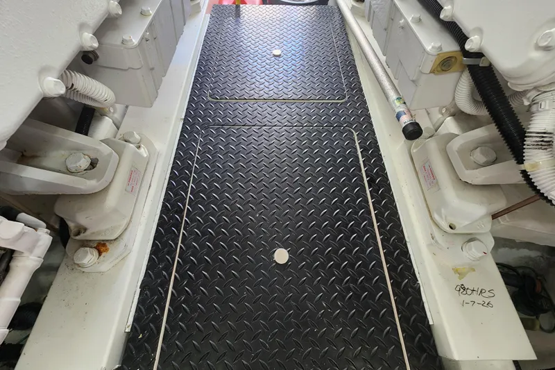 Slide: The Image of Engine room of a 2018 Viking 48 Sport Tower with diamond plate flooring. - 160