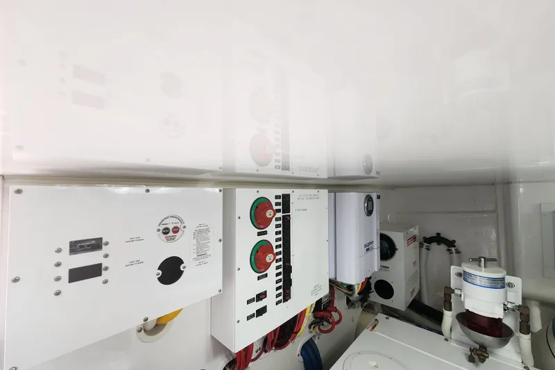 Slide: The Image of Electrical panel in 2018 Viking 48 Sport Tower engine room, showcasing control systems. - 162