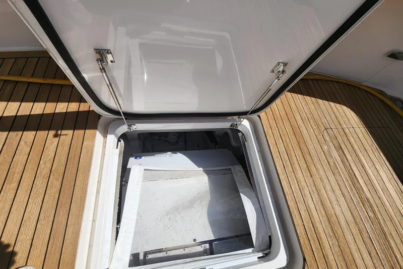 Slide: The Image of Open hatch on 2018 Viking 48 Sport Tower with teak deck. - 163